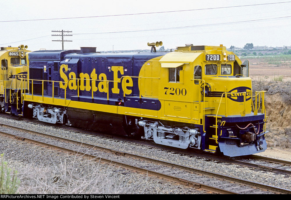 Santa Fe SDX train led by SF30B ATSF #7200 waits to meet a "San Diegan" at Ponto.